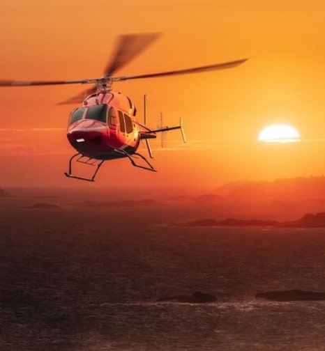 Red Helicopter with sunset background