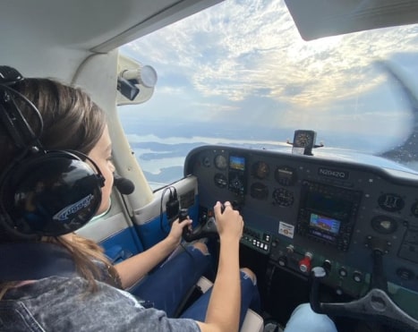 Girl flying an Airplane